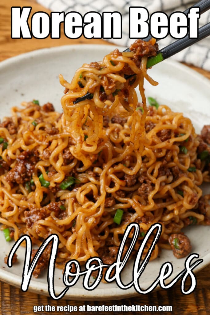 Korean beef noodles on a plate with a checked white and navy linen and chopsticks and text overlay describing the photo