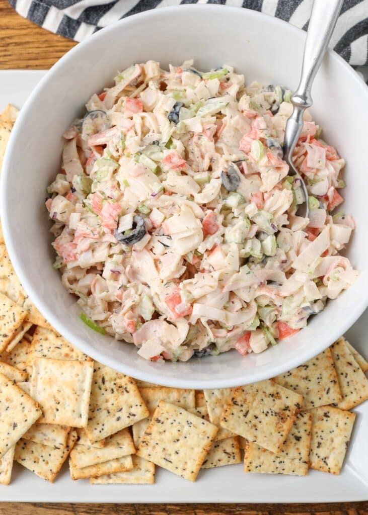 crab salad in a bowl with crackers