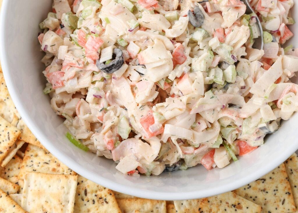 crab salad in a bowl with crackers