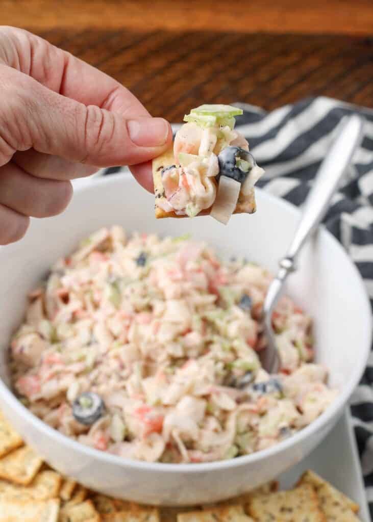 crab salad in a bowl with crackers