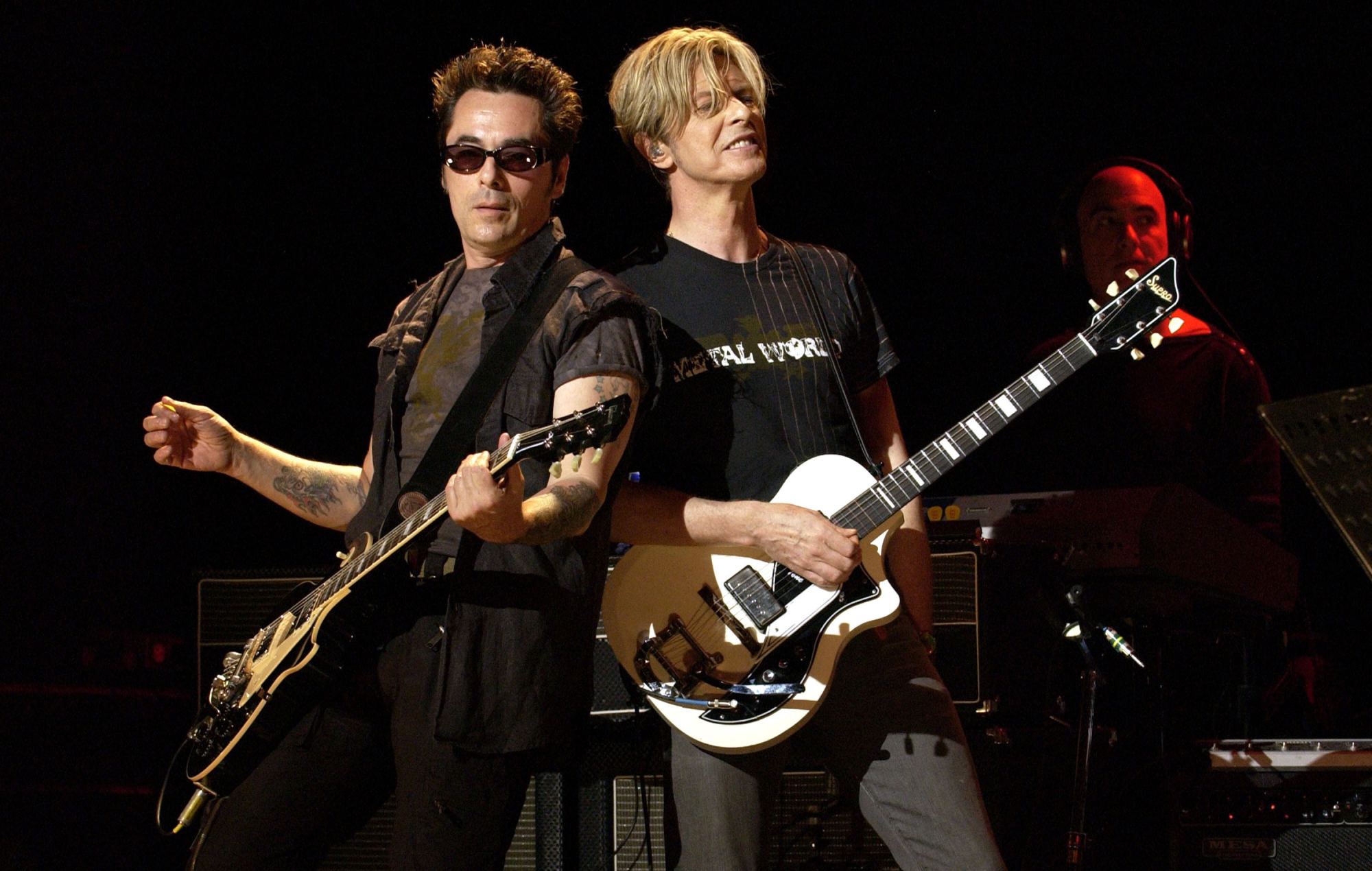Earl Slick and David Bowie on the 'Reality' tour, 2003 (Photo by KMazur/WireImage)