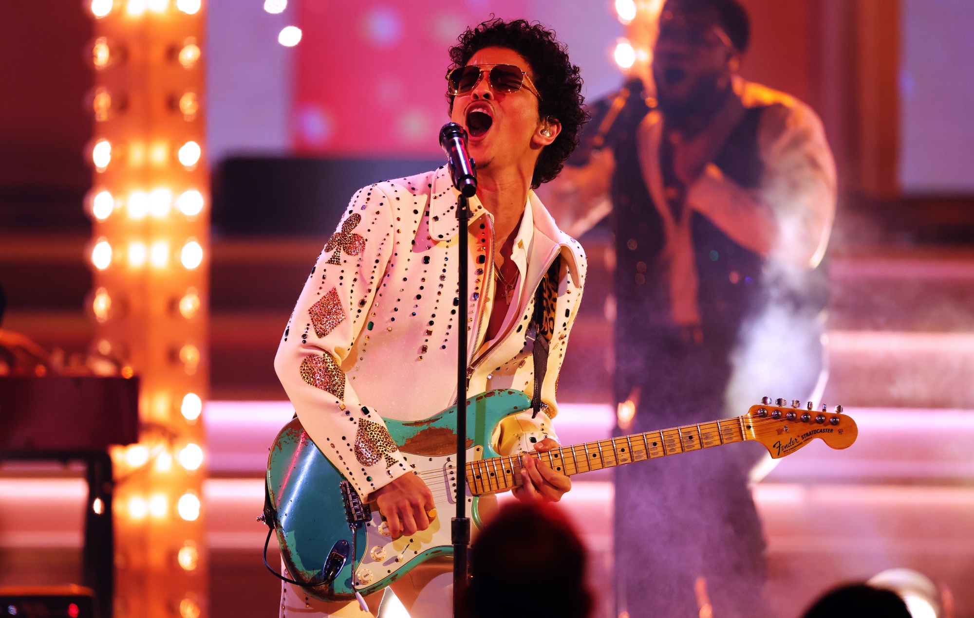 Bruno Mars performing live on stage, photo by Rich Fury/Getty Images for The Recording Academy