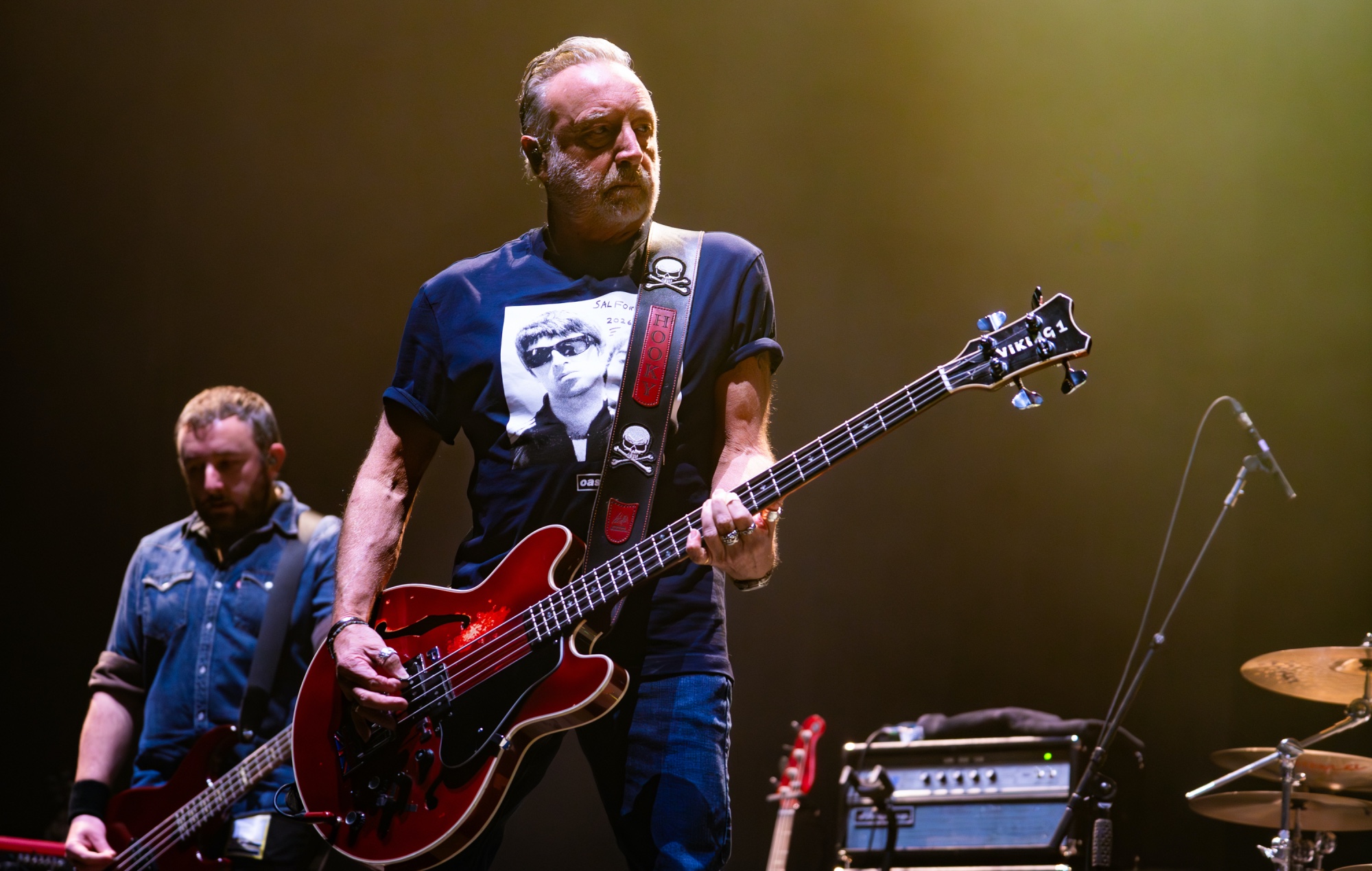 Peter Hook performing live on stage, photo by Lorne Thomson/Redferns/Getty