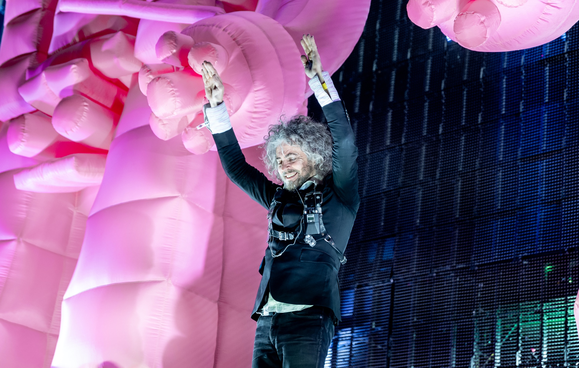 Wayne Coyne performing live on stage with The Flaming Lips, photo by Pedro Gomes/Redferns/Getty