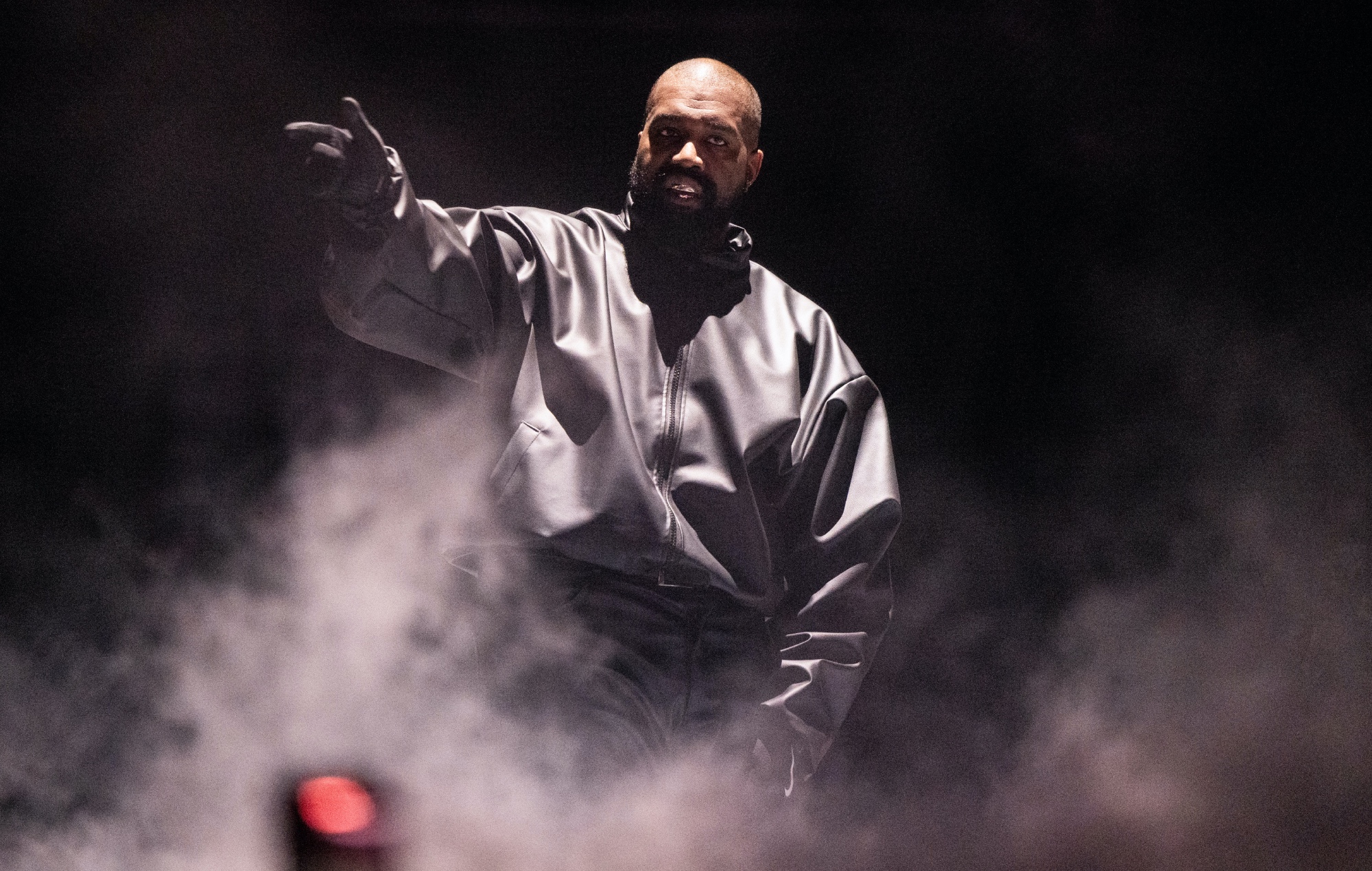 Kanye West performing live on stage, photo by Scott Dudelson/Getty
