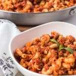 Cooked macaroni with tomato sauce, chopped tomatoes, onion, green pepper and Italian seasoning.