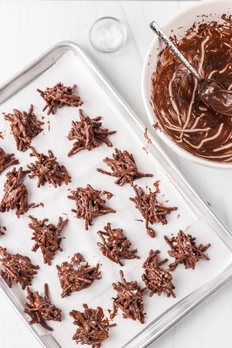 Making chocolate peanut butter chow mein cookies.