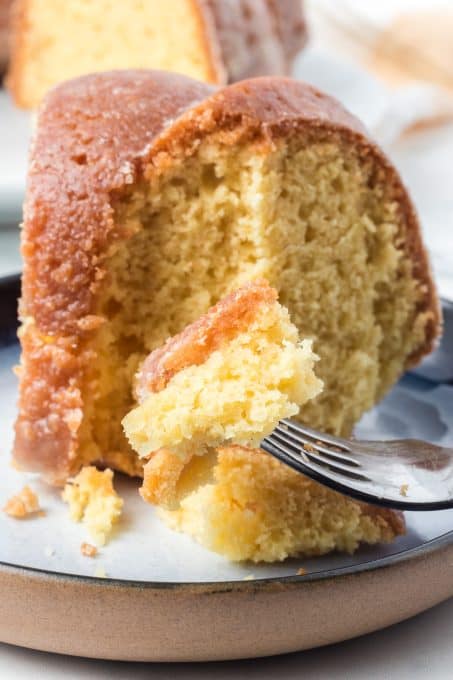 A bite of a cake soaked with rum.