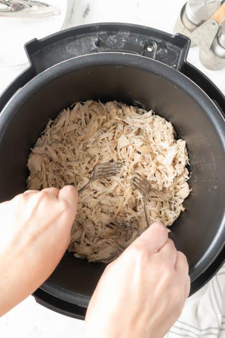 Shredding chicken in the Instant Pot.