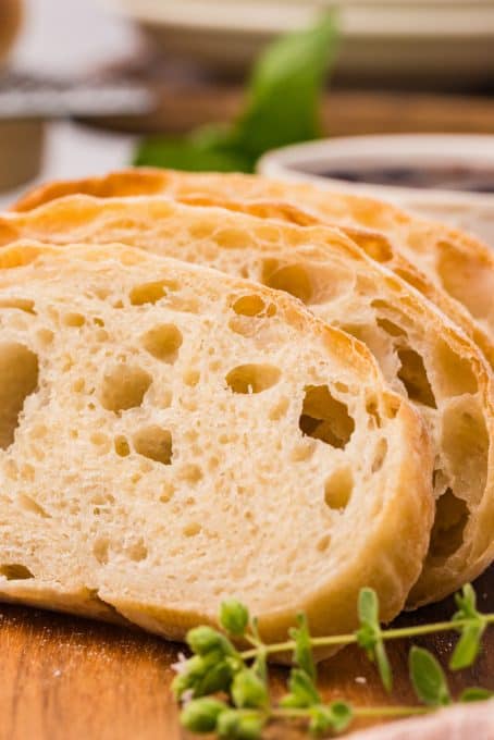 Slices of Ciabatta on a cutting board.