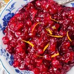 A bowl of fresh cranberries made into a sauce.