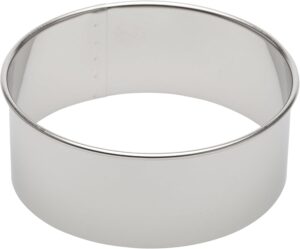 Stainless steel circular cake ring mold, empty and ready to use.