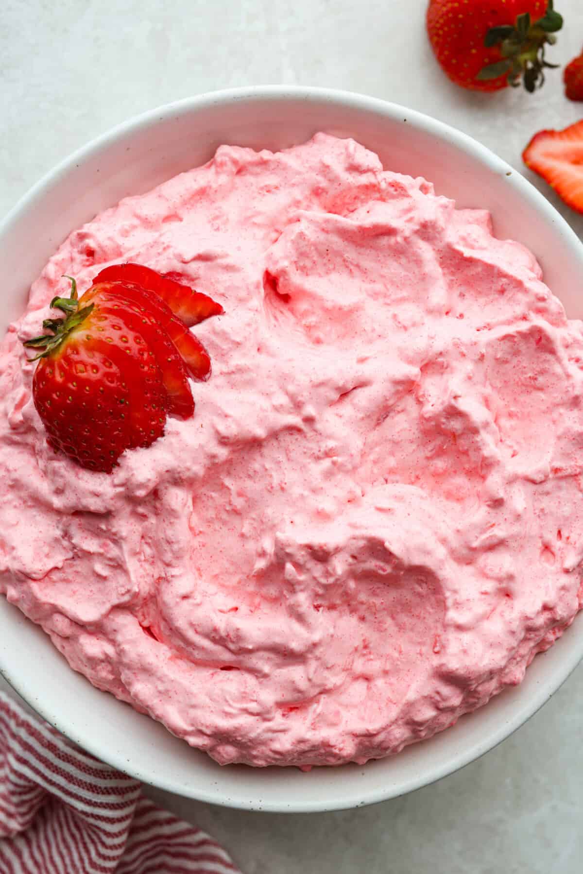 Bowl of strawberry cottage cheese Jello salad.