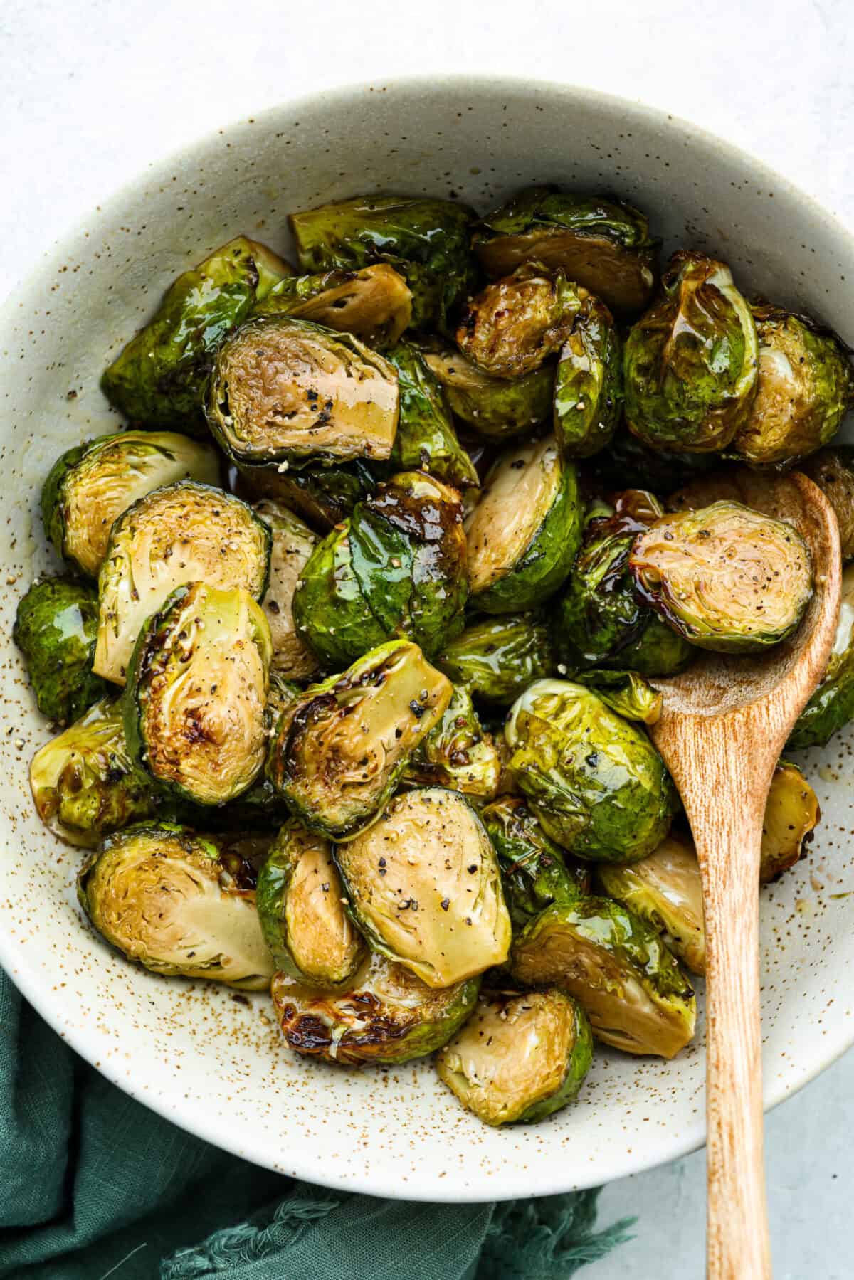 Bowl of air fryer brown sugar Brussels sprouts. 
