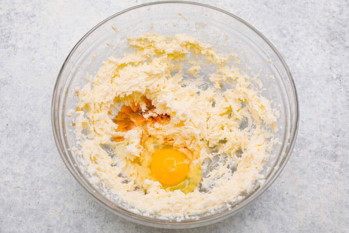 Egg and vanilla added to the beaten butter and sugar. 