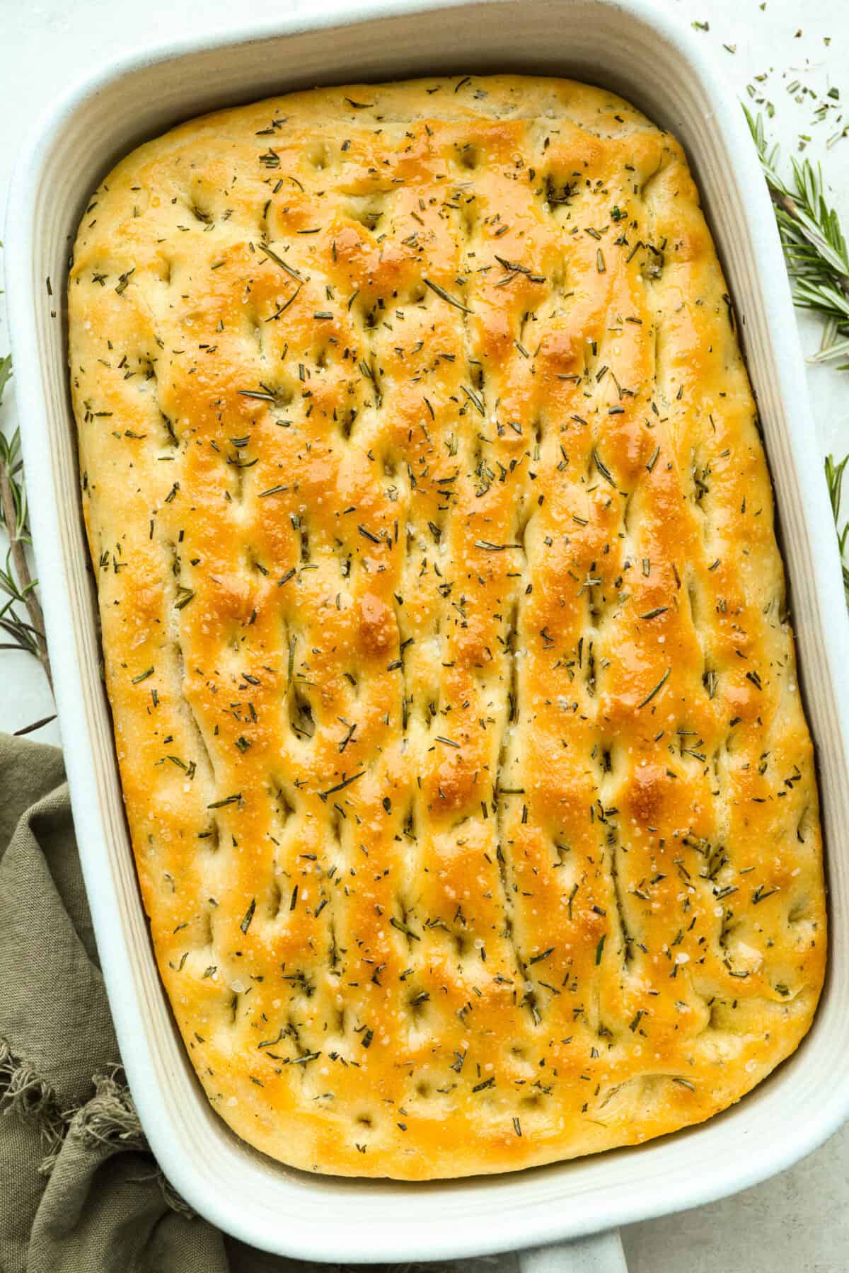 Baked focaccia in a baking dish. 