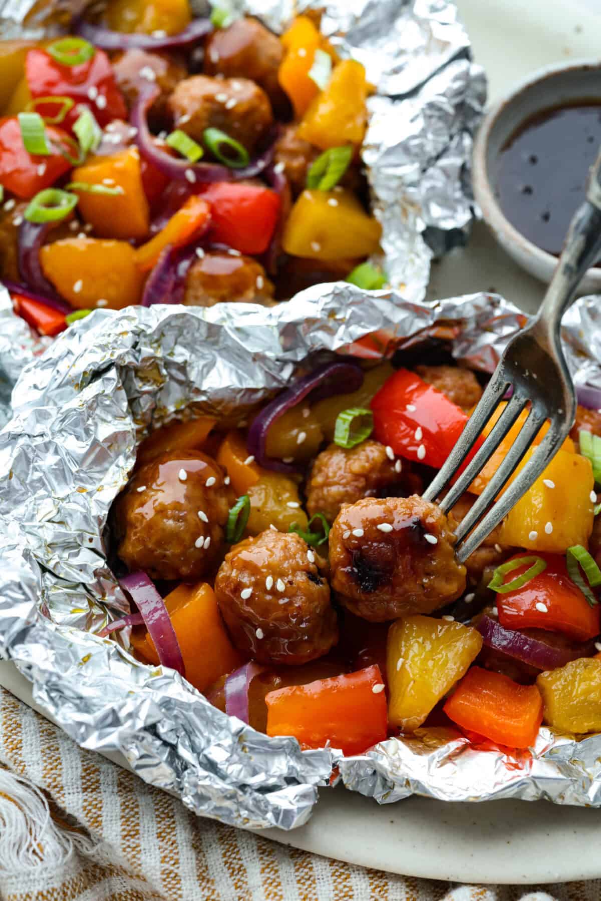 Meatball foil packets with veggies and pineapple. 