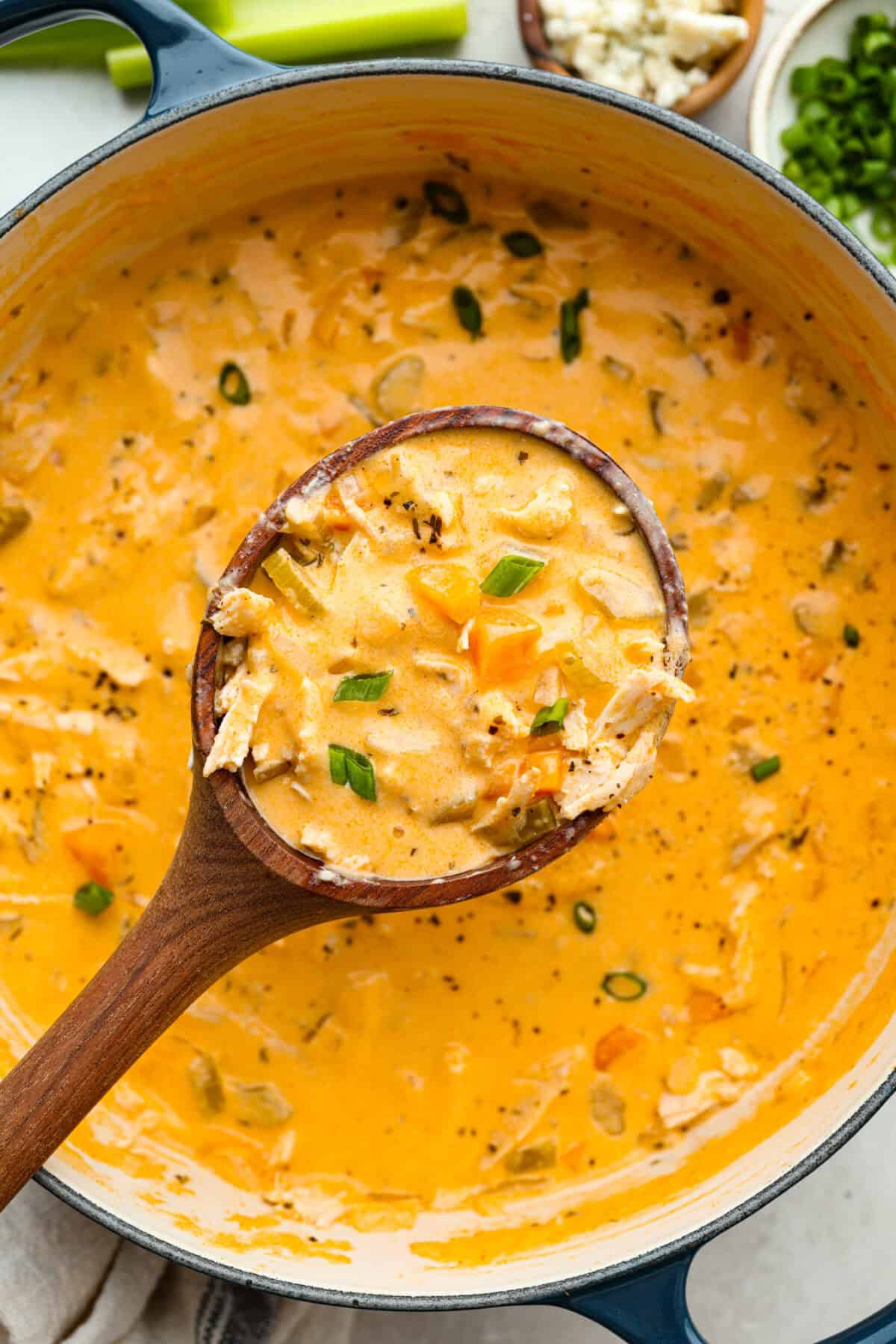 Close up shot of a scoop of the buffalo chicken soup. 