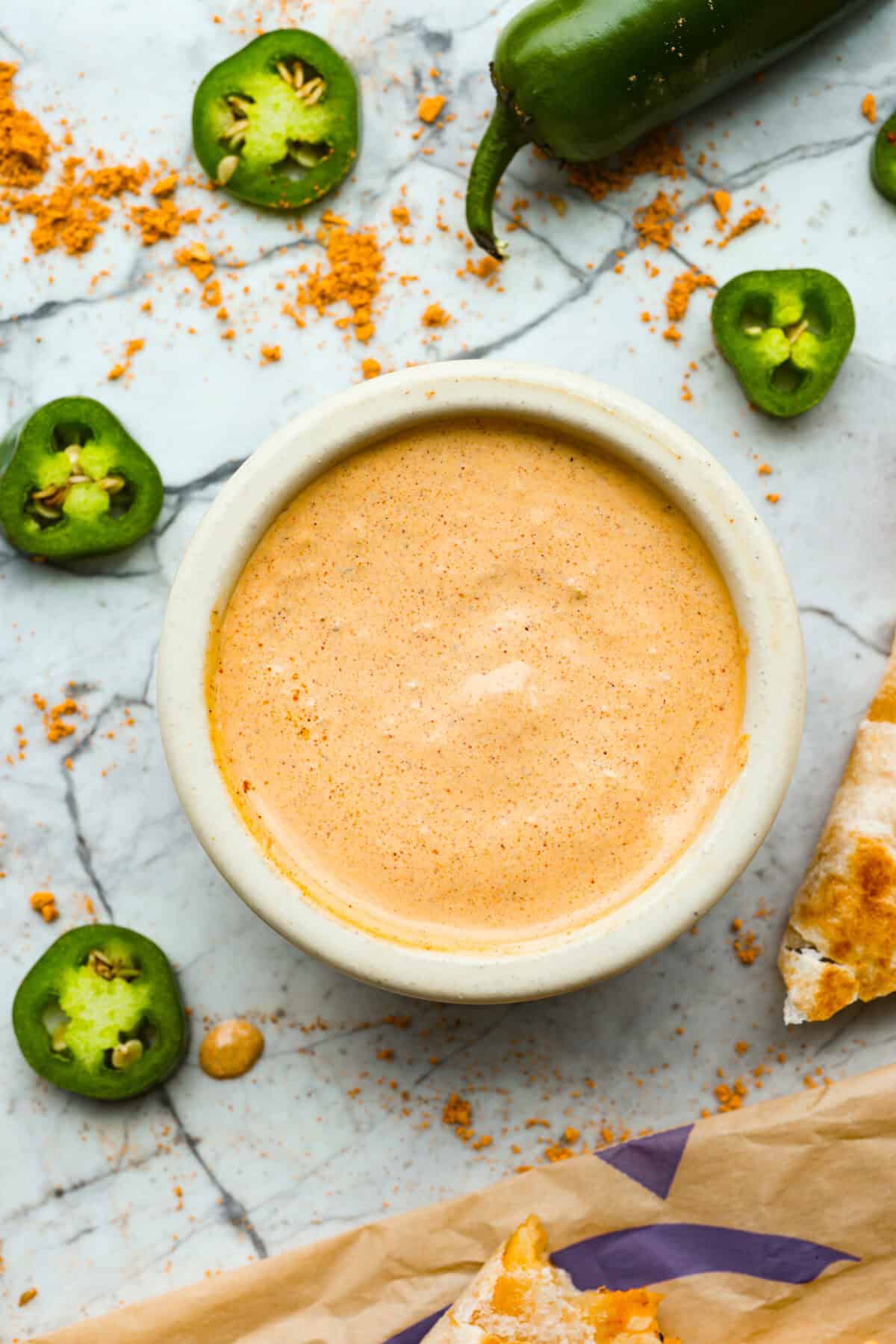 Overhead shot of a bowl of sauce. 