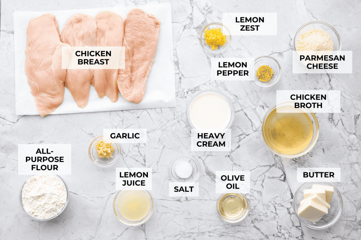 Overhead shot of labeled lemon butter chicken ingredients. 