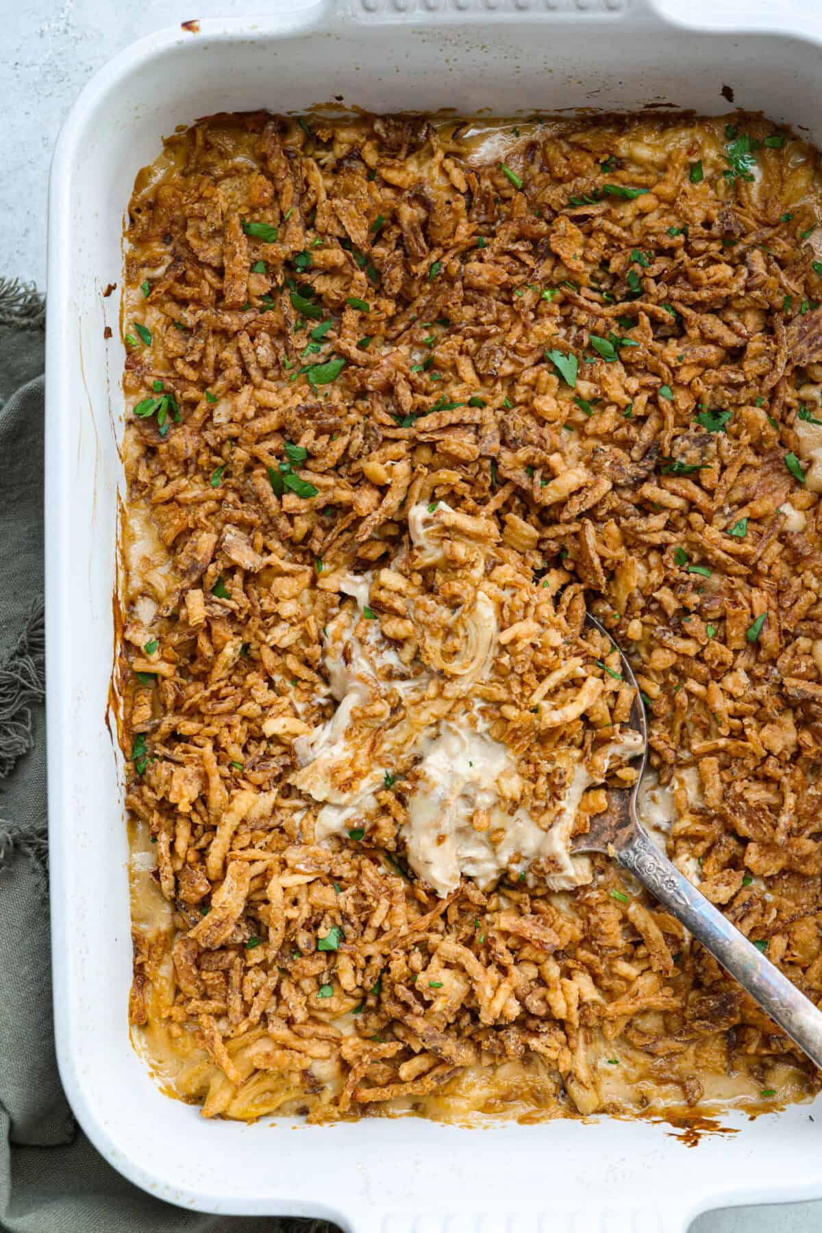Overhead shot of baked French onion chicken casserole in a baking dish. 
