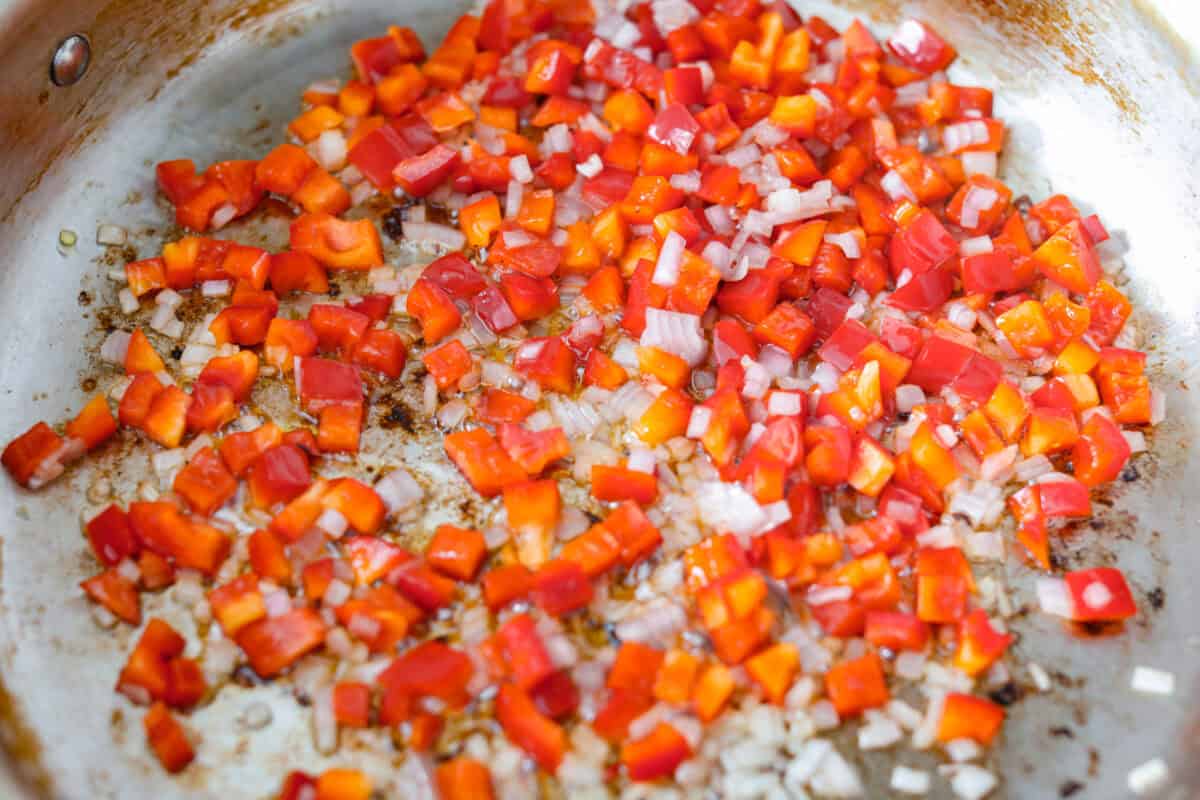 Veggies cooking in a pan. 