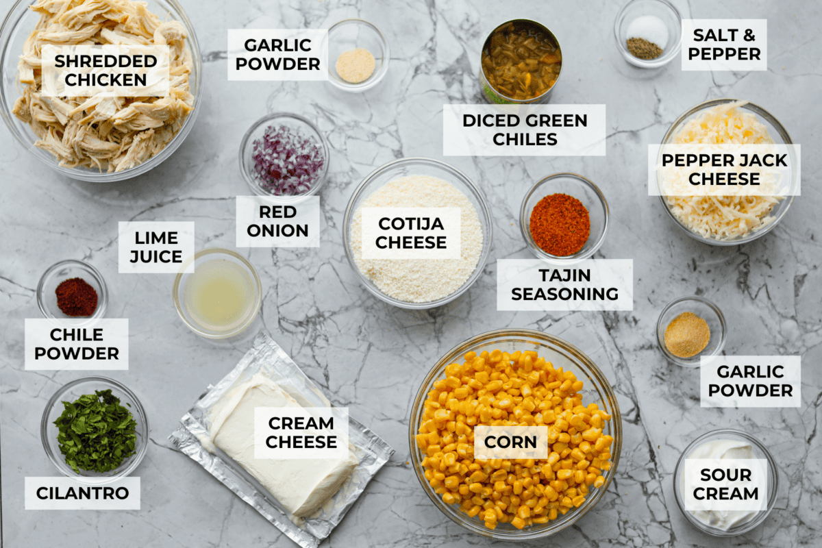 Overhead shot of labeled Mexican street corn chicken casserole ingredients.