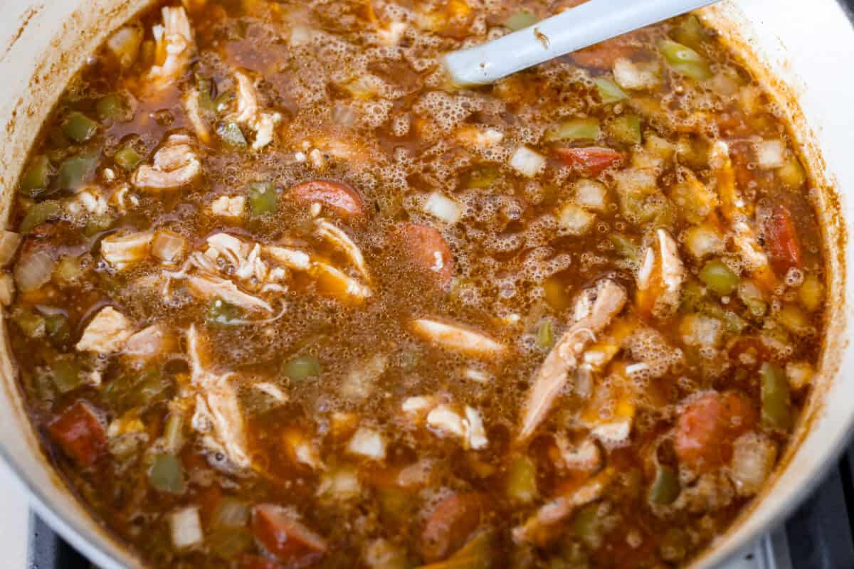 All of the ingredients simmering in a big pot on the stove.