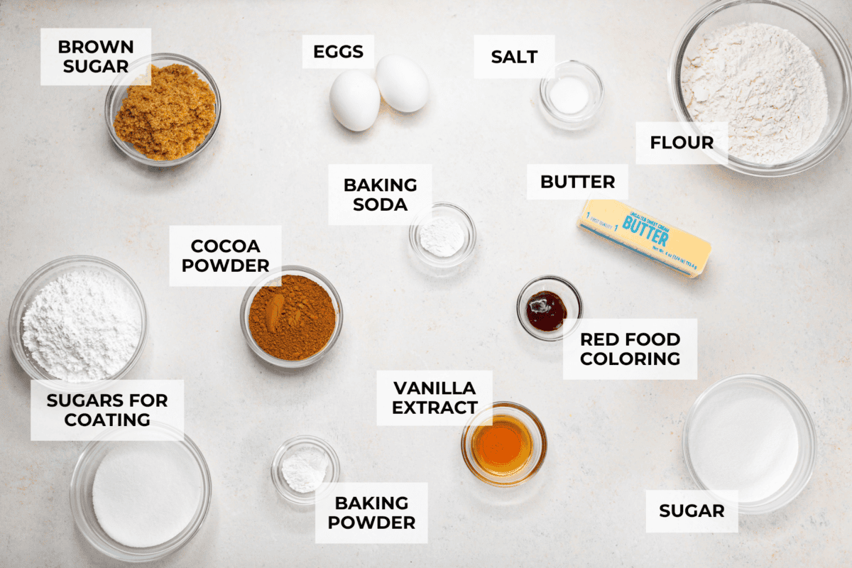 Overhead shot of labeled red velvet crinkle cookies ingredients. 
