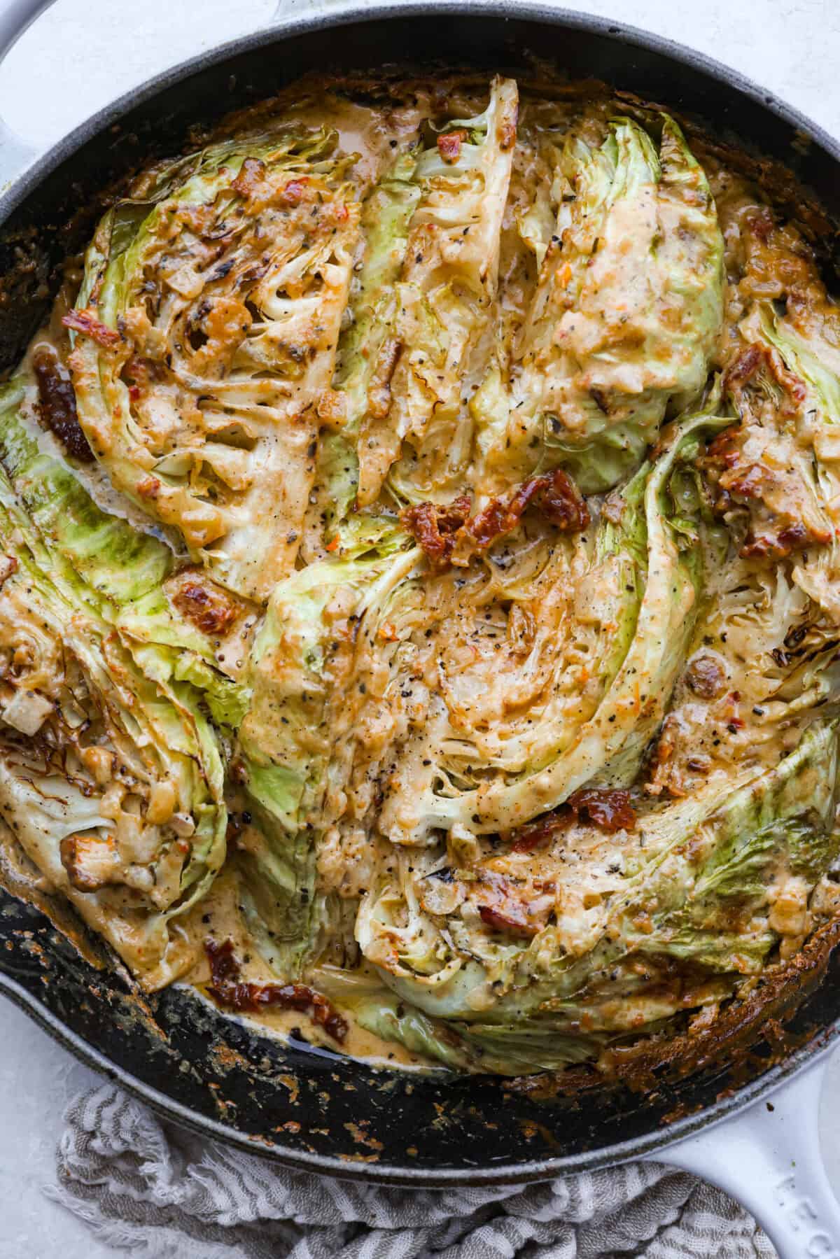 Skillet with creamy tuscan melting cabbage all cooked and ready to eat. 