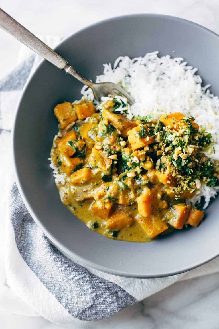 Creamy sweet potato curry in a bowl with rice.
