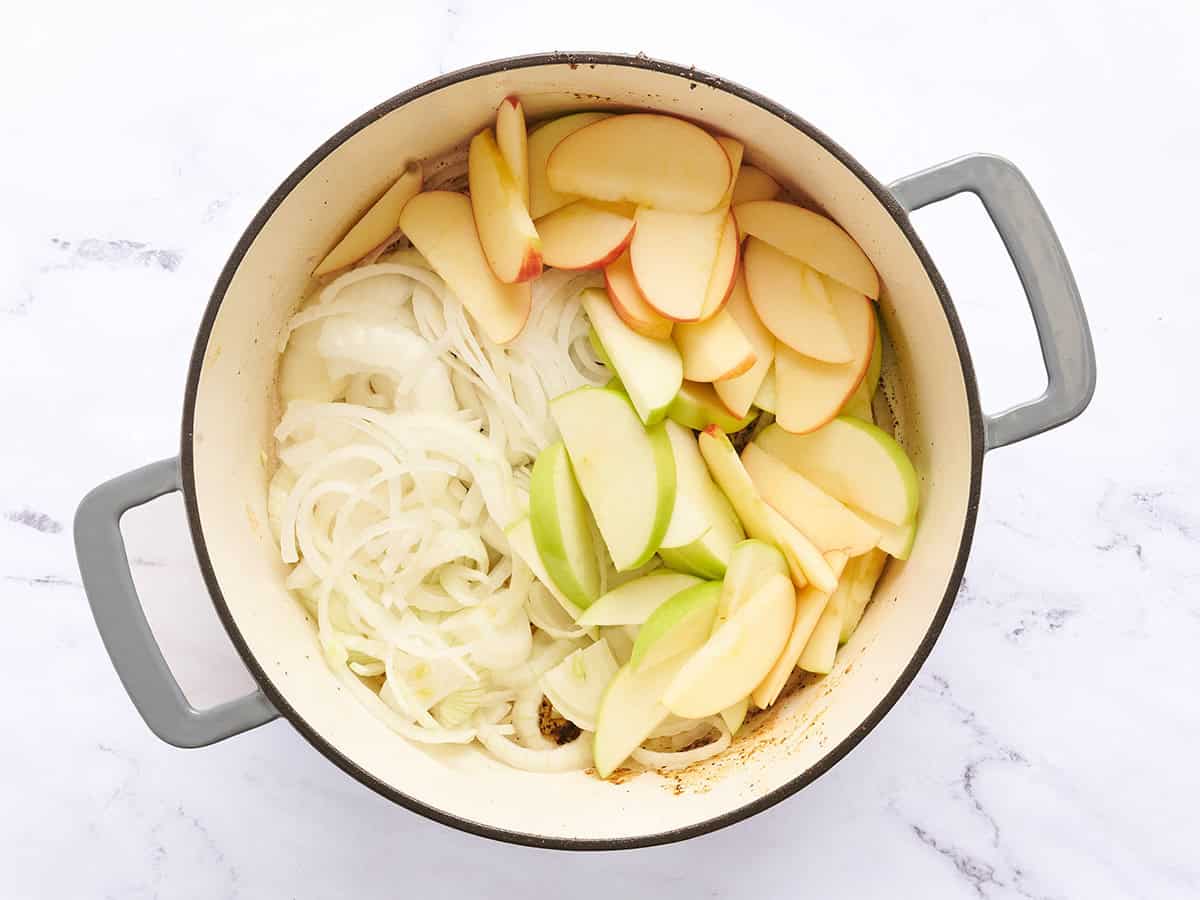 Apples and onion in a dutch oven.