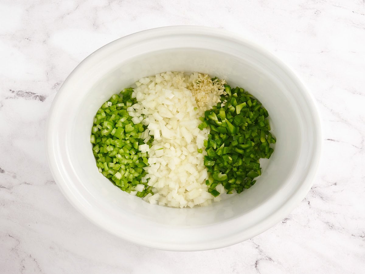 Diced celery, onion, and green pepper in a crockpot. 
