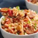 a fork taking a bite out of Slow Cooker Jambalaya