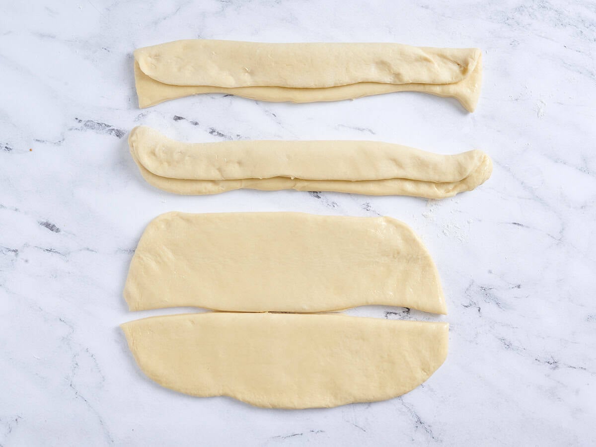 Folding the dough and cutting it into rectangles.