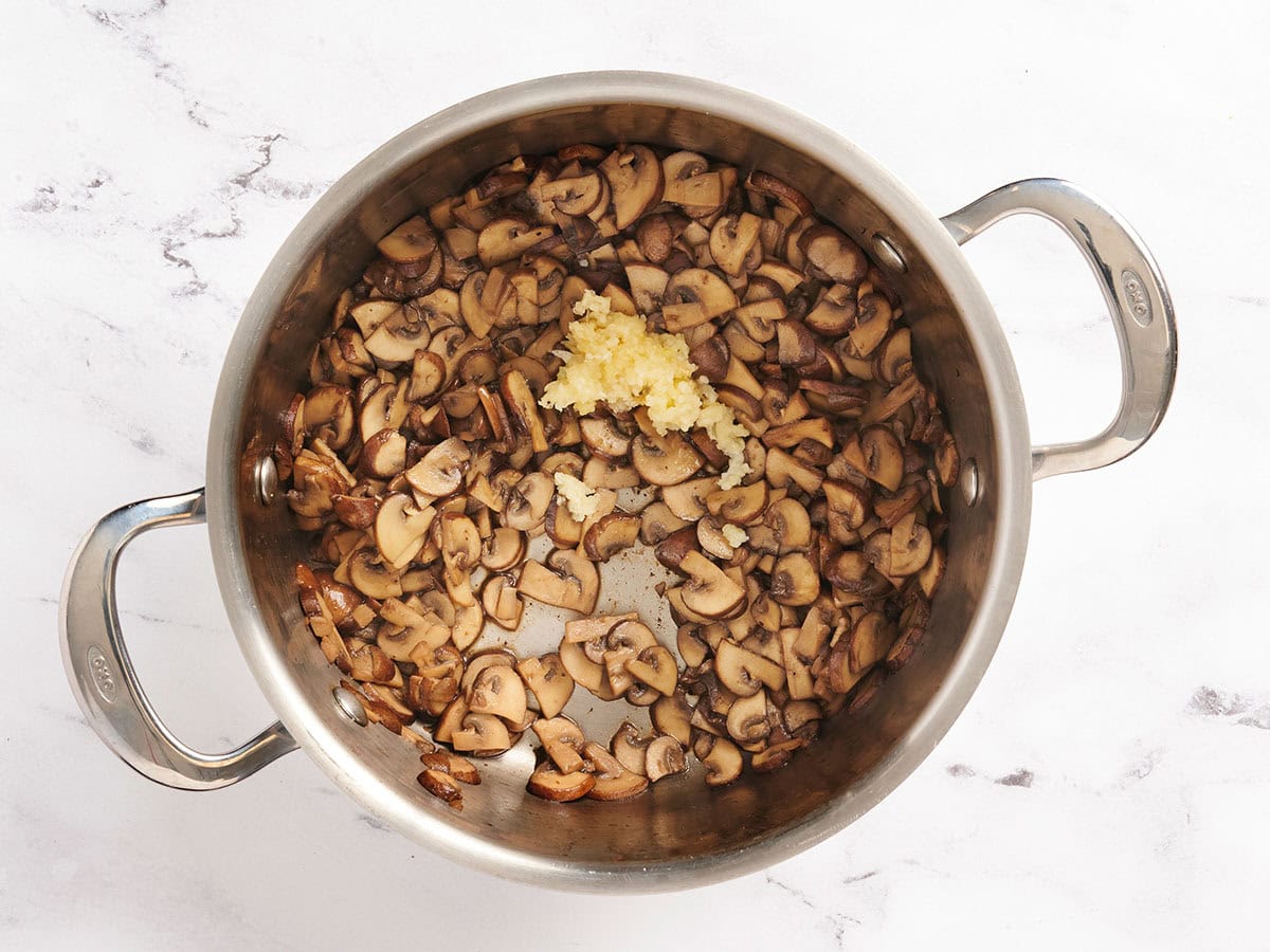 Mushrooms on a pan with garlic.