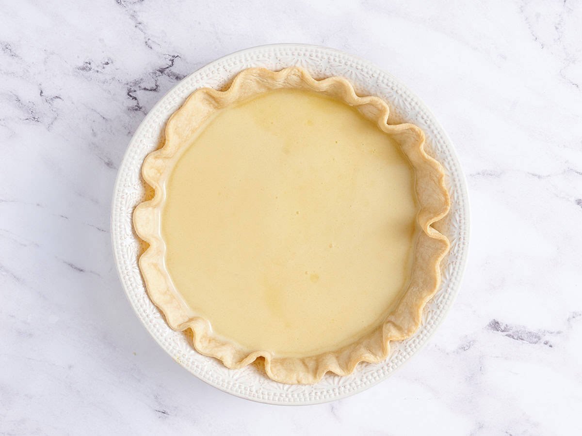 Chess pie filling added to a pie crust.