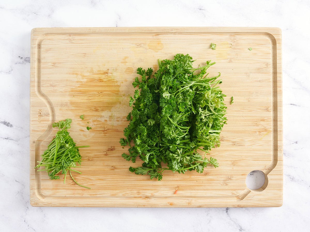 Minced parsley on a cutting board.