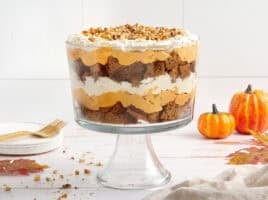 Side view of an assembled pumpkin trifle in a trifle bowl.