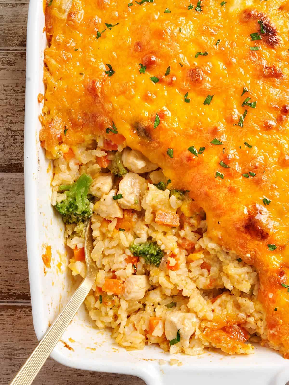 Overhead view of chicken and rice casserole with a spoon.