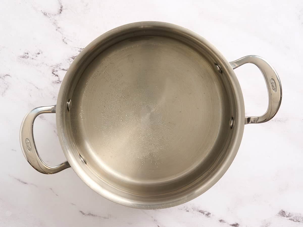 Salted water boiling in a pot.