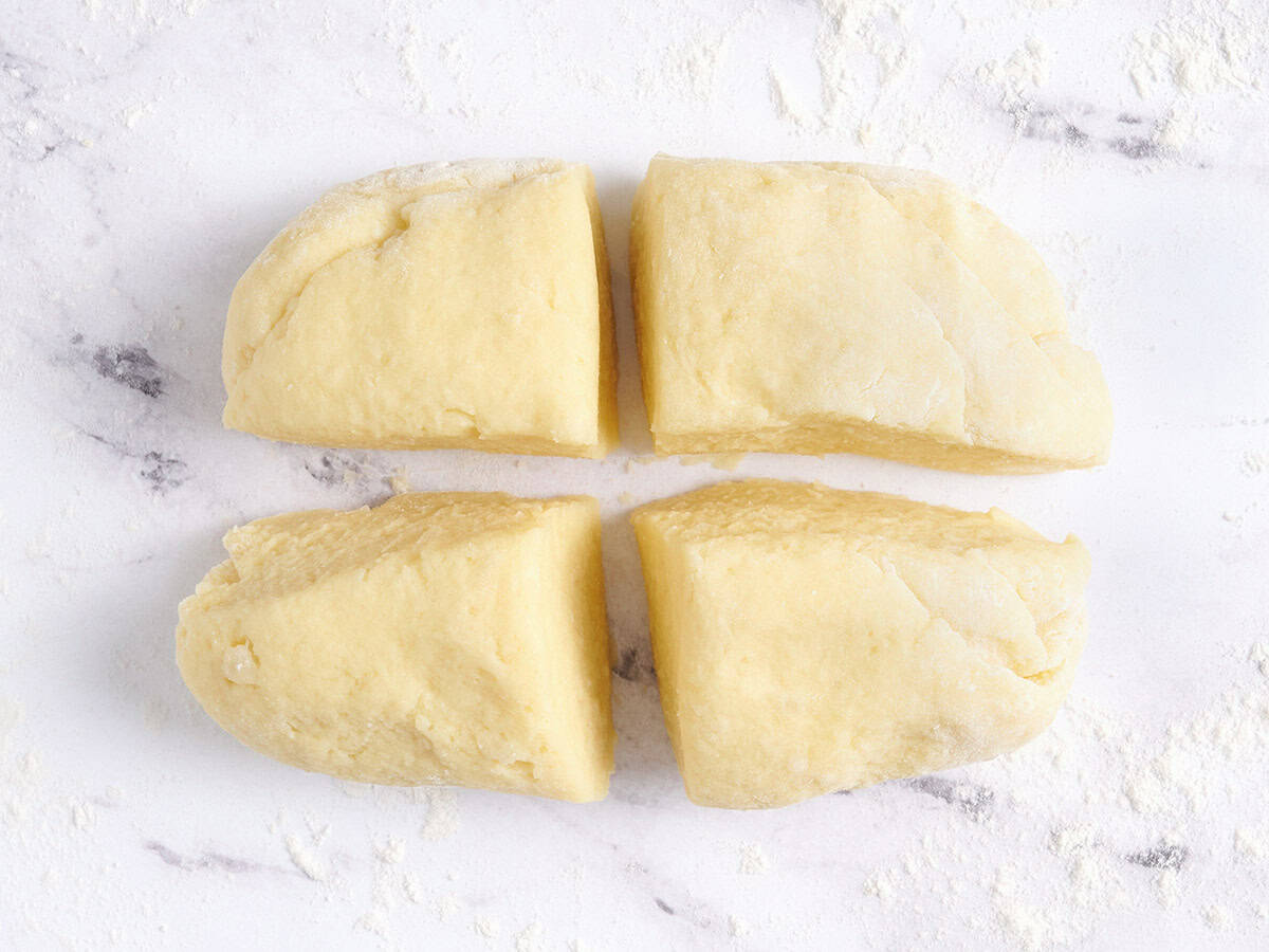 Gnocchi dough divided into 4 portions. 