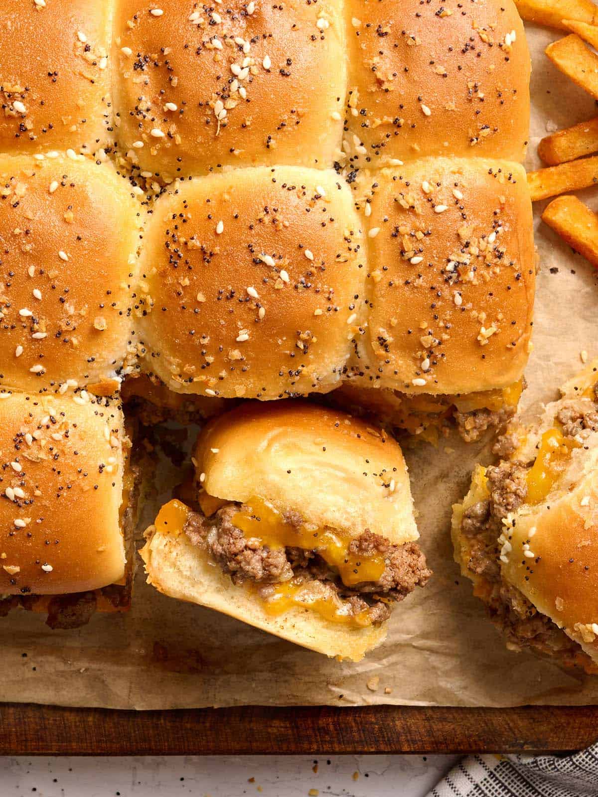 Overhead view of sliders on parchment paper.