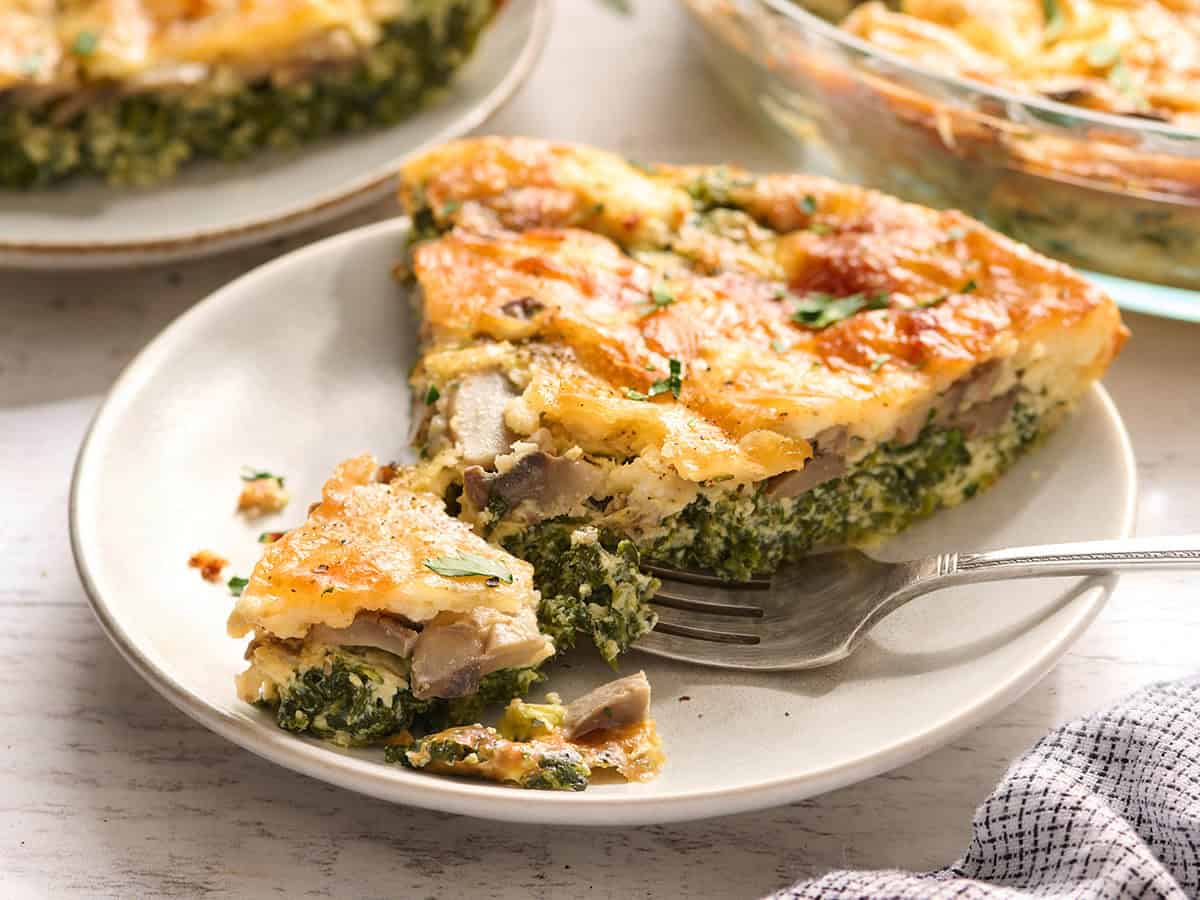 Side view of a slice of crustless quiche.