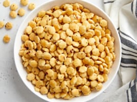 Overhead photo of ranch oyster crackers in a white serving bowl.