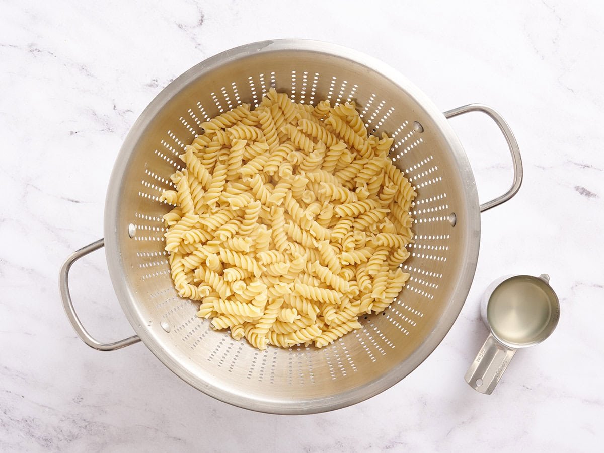 Cooked pasta in a colander.