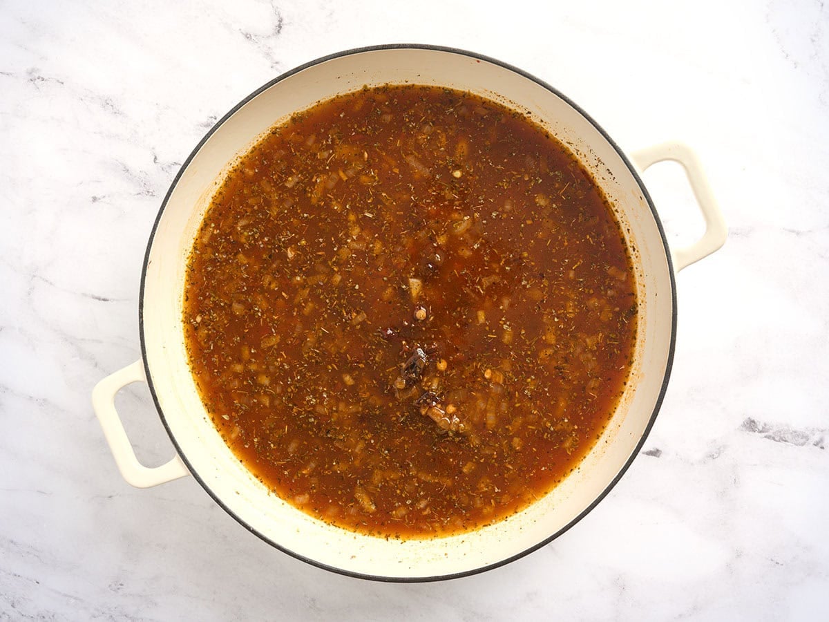 The ingredients for marry me lentils combined in a pot.