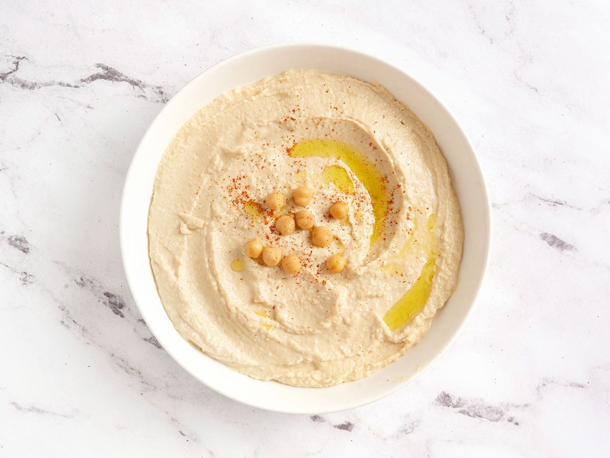 Overhead view of a bowl of homemade hummus.