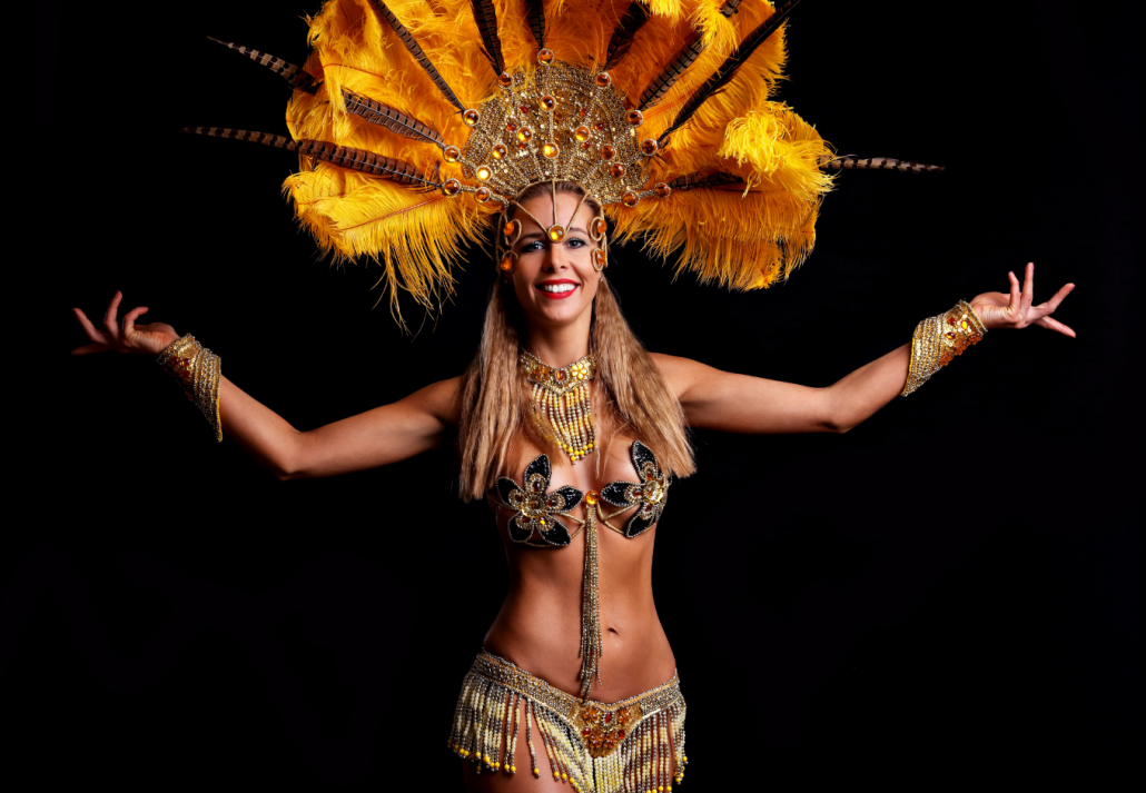 Brazilian woman posing in samba costume over black background